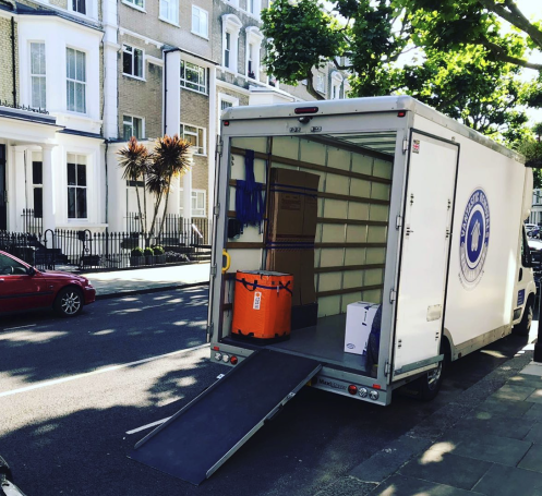 Vantastic Removals van poised for a significant house move in Kensington, London.