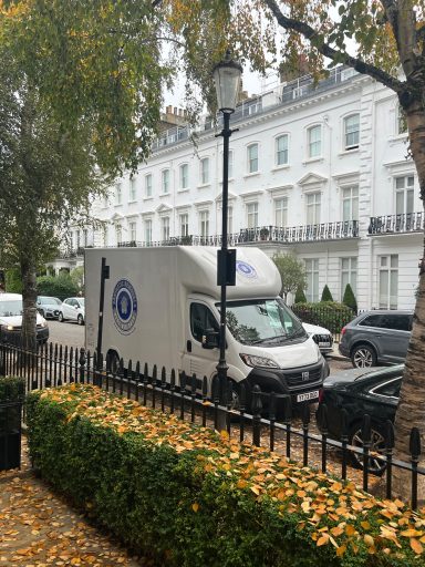 Vantastic Removals team carefully packing belongings in a luxury Chelsea home, ensuring every item is secure for transit.