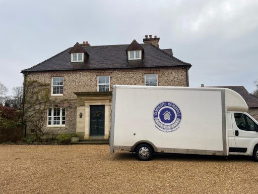 Vantastic Removals team loading a moving van outside a picturesque country house, ensuring a smooth and efficient rural move.