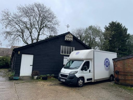 Vantastic Removals van parked by a scenic countryside estate, preparing for a meticulous rural home relocation